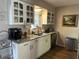 Bright kitchen featuring updated cabinetry, granite countertops, and modern appliances at 58 Magnolia Dr, Debary, FL 32713
