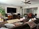 Spacious living room featuring hardwood floors and a ceiling fan at 58 Magnolia Dr, Debary, FL 32713