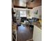 Inviting living room with hardwood floors, a fireplace, and built-in shelving at 58 Magnolia Dr, Debary, FL 32713