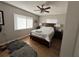 Comfortable bedroom with natural light, hardwood floors, and a ceiling fan at 58 Magnolia Dr, Debary, FL 32713