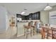 Inviting kitchen with breakfast bar and seating area, perfect for casual dining at 5910 Windsong Oak Dr, Leesburg, FL 34748