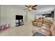 Spacious living room with comfortable seating and entertainment area at 5910 Windsong Oak Dr, Leesburg, FL 34748