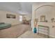 Open-concept living room with large windows, modern decor, and a dining area at 5910 Windsong Oak Dr, Leesburg, FL 34748