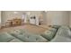 Spacious living room with plush sofa, dining area, and neutral color palette at 5910 Windsong Oak Dr, Leesburg, FL 34748