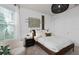 Serene bedroom offering a comfortable bed, a wardrobe and natural light at 6032 Tree Crossing Ln, St Cloud, FL 34771
