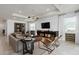 Cozy living room featuring stylish decor, comfortable seating, and natural light for a welcoming ambiance at 6032 Tree Crossing Ln, St Cloud, FL 34771
