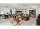 Spacious open-concept living area with stylish furnishings and an easy transition to the kitchen and dining spaces at 6038 Tree Crossing Ln, St Cloud, FL 34771