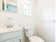 Cozy bathroom featuring modern fixtures, a toilet and a vanity with a sink at 612 Kensington St, Eustis, FL 32726