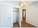 Bedroom with a closet featuring a door, carpet floors, and white walls at 612 Kensington St, Eustis, FL 32726