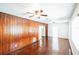 Bright living room with wood accents, ceiling fan, and hardwood floors at 612 Kensington St, Eustis, FL 32726