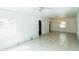 Bright living room featuring tile floors, a dining area and abundant natural light at 612 Kensington St, Eustis, FL 32726