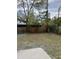 The backyard featuring lush greenery and a mix of trees, plants and a wooden fence at 6130 Gamble Dr, Orlando, FL 32808