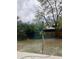A backyard featuring grass, plants, trees and a view through a large window at 6130 Gamble Dr, Orlando, FL 32808