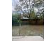 A backyard featuring grass, plants, trees and a view through a large window at 6130 Gamble Dr, Orlando, FL 32808