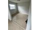 Bedroom showcasing neutral paint and tiled floors at 6130 Gamble Dr, Orlando, FL 32808