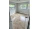 Bedroom with neutral colored tile flooring, natural light and windows with lush outdoor views at 6130 Gamble Dr, Orlando, FL 32808