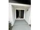 Front entrance with black double doors and a gray painted porch at 6130 Gamble Dr, Orlando, FL 32808