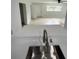 Open-concept kitchen features stainless steel faucet and breakfast bar at 6130 Gamble Dr, Orlando, FL 32808