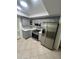Charming kitchen features stainless steel appliances and gray cabinets at 6130 Gamble Dr, Orlando, FL 32808