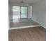 Bright living room featuring laminate floors and tiled accents at 6130 Gamble Dr, Orlando, FL 32808