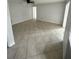 Spacious living room features tile flooring and ceiling fan at 6130 Gamble Dr, Orlando, FL 32808