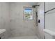 Beautiful bathroom with a rain shower head, tile and a view of outside through the window at 819 State Ave, Daytona Beach, FL 32117