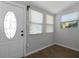 Bright entryway with wood floors, natural light, and a classic white door at 819 State Ave, Daytona Beach, FL 32117