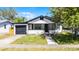 Beautifully kept home with a front lawn, garage, and covered porch at 819 State Ave, Daytona Beach, FL 32117
