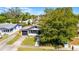 Aerial view showcasing a charming home with front yard and driveway at 819 State Ave, Daytona Beach, FL 32117