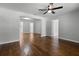 Open living space featuring hardwood floors and light colored walls with views into other rooms at 819 State Ave, Daytona Beach, FL 32117
