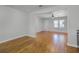 Bright living room with hardwood floors, fresh paint, ceiling fan, and plenty of natural light at 819 State Ave, Daytona Beach, FL 32117