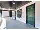 Inviting front porch featuring light gray floors, and a stylish door at 819 State Ave, Daytona Beach, FL 32117