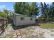 Spacious backyard featuring a separate shed and privacy fence at 831 Wolf Trl, Casselberry, FL 32707