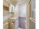 Bathroom featuring a vanity, toilet, and glass-door shower at 831 Wolf Trl, Casselberry, FL 32707