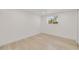 Bright bedroom with vinyl floors, recessed lights, and a sun-filled window at 831 Wolf Trl, Casselberry, FL 32707