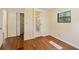 Bedroom with hardwood floors, a window, closet, and an ensuite bathroom at 831 Wolf Trl, Casselberry, FL 32707