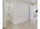 A bright bedroom with a closet and vinyl floors, next to a kitchen at 831 Wolf Trl, Casselberry, FL 32707
