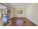 Bright dining room featuring wood floors, natural light, and access to a screened deck at 831 Wolf Trl, Casselberry, FL 32707