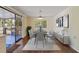 Dining room area featuring modern decor, hardwood floors and a sliding glass door leading to the porch at 831 Wolf Trl, Casselberry, FL 32707