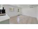 Modern living area with vinyl floors, mini-split AC unit, and view of the outdoor at 831 Wolf Trl, Casselberry, FL 32707