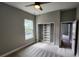 Bedroom offers natural light with a window view, and closet for organized storage at 947 Ferne Dr, Longwood, FL 32779