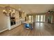 Bright kitchen featuring white cabinets, stainless steel appliances, a large island, and wood-look tile flooring at 947 Ferne Dr, Longwood, FL 32779