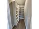 Walk-in pantry with plenty of shelving and wood-look flooring at 947 Ferne Dr, Longwood, FL 32779