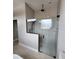 Walk-in shower with black hardware and herringbone tile at 947 Ferne Dr, Longwood, FL 32779