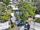 Aerial view of community homes showcasing lush trees, well-maintained roofs, and manicured landscaping at 105 Canal Vw, Eustis, FL 32726