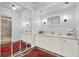 Full bathroom with dual vanity, white cabinets, and walk-in shower at 105 Canal Vw, Eustis, FL 32726