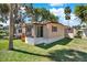 Charming single-story home with well-maintained lawn and convenient exterior storage at 105 Canal Vw, Eustis, FL 32726