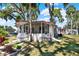 Charming single-story home with screened-in porch and well-manicured lawn at 105 Canal Vw, Eustis, FL 32726