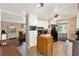 Functional kitchen with white cabinetry, breakfast bar, and tile flooring at 105 Canal Vw, Eustis, FL 32726