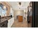 Well-lit kitchen boasts tile flooring, efficient appliances, and seamless breakfast nook access at 105 Canal Vw, Eustis, FL 32726